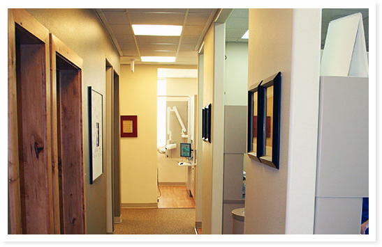 The hallway and an exam room at Doman Dental