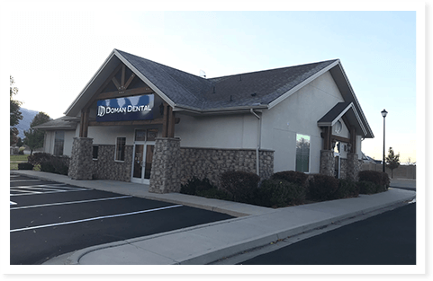 An exterior shot of Doman Dental and the parking lot.